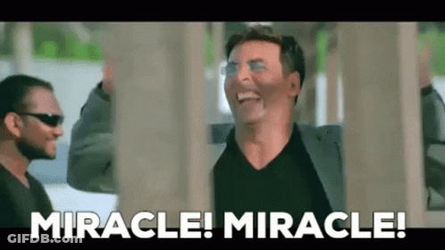 A Man Is Laughing And Saying `` Miracle ! Miracle ! '' In Front Of A Group Of Men . GIF