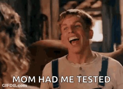 A Man Is Laughing And Saying `` Mom Had Me Tested '' While Standing Next To A Woman . GIF