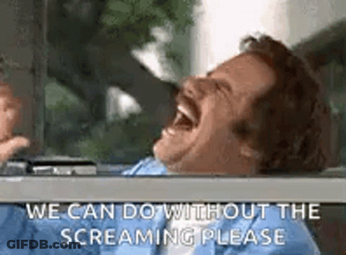 A Man Is Laughing In A Car With His Mouth Open And Says `` We Can Do Without The Screaming Please '' . GIF
