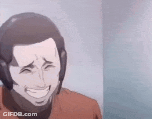 A Man Is Laughing While Wearing A Helmet And A Red Shirt . GIF