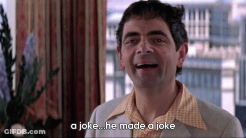 A Man Is Laughing With The Words A Joke He Made A Joke Below Him GIF