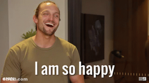 A Man Is Laughing With The Words I Am So Happy Above Him GIF