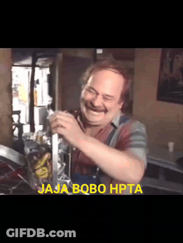 A Man Is Laughing With The Words Jaja Bobo Hpta Behind Him GIF