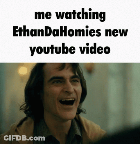 A Man Is Laughing With The Words Me Watching Ethandahomies New Youtube Video Below Him GIF