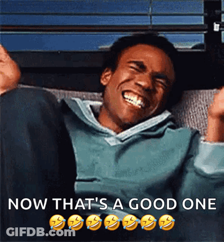 A Man Is Laughing With The Words Now That 'S A Good One Above Him GIF