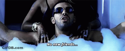 A Man Is Laying In A Bathtub With Bubbles And Says No New Friends .. GIF