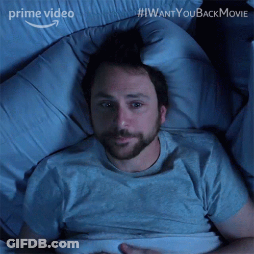 A Man Is Laying In A Bed With The Words " I Want You Back Movie " On The Bottom GIF