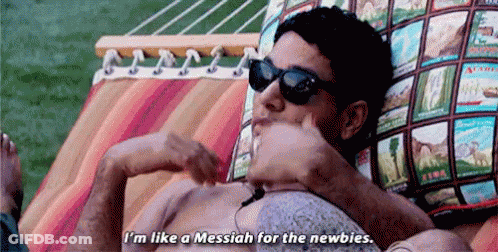 A Man Is Laying In A Hammock Wearing Sunglasses And A Shirtless Body . GIF