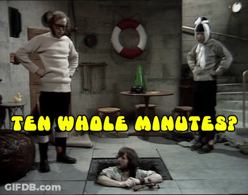 A Man Is Laying In A Hole With The Words Ten Whole Minutes Written Above Him GIF