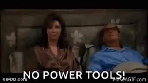 A Man Is Laying In A Hospital Bed With A Woman . GIF