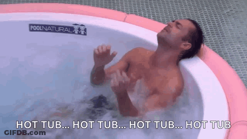 A Man Is Laying In A Hot Tub With The Words Hot Tub Written On The Bottom GIF