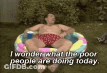 Man In Pool With I Wonder What The Poor Are Doing GIF