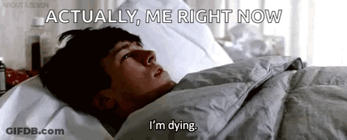 A Man Is Laying In Bed With The Words `` Actually , Me Right Now I 'M Dying '' Written On The Screen . GIF