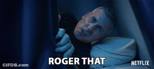 A Man Is Laying In Bed With The Words Roger That Written On The Bottom GIF