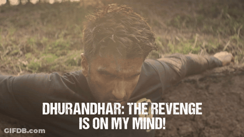 A Man Is Laying In The Dirt With The Words " Dhurandhar The Revenge Is On My Mind " Above Him GIF