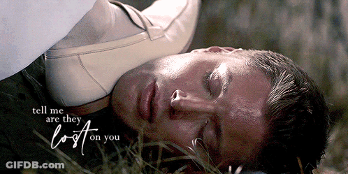 A Man Is Laying In The Grass With The Words Tell Me Are They Lost On You GIF