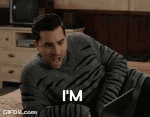 A Man Is Laying On A Bed Looking At A Laptop And Saying I 'M Obsessed . GIF