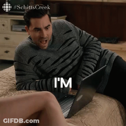 A Man Is Laying On A Bed Using A Laptop And Says I 'M GIF
