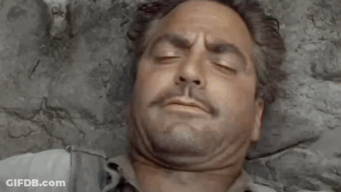 A Man Is Laying On A Bed With His Eyes Closed And The Words `` Good Morning '' Written Above Him . GIF