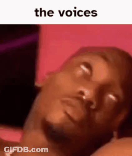 A Man Is Laying On A Bed With His Eyes Closed And The Words `` The Voices '' Written Above Him . GIF