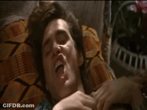 Man Lying On Bed With Mouth Open GIF