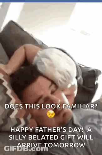 A Man Is Laying On A Couch With A Baby On His Head . GIF