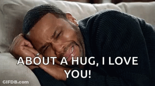 A Man Is Laying On A Couch With His Head On His Hand And Says `` About A Hug , I Love You '' . GIF