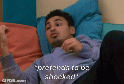 A Man Is Laying On A Couch With The Words Pretends To Be Shocked GIF