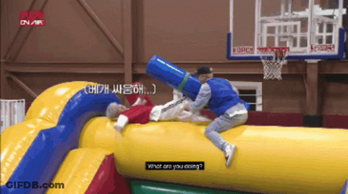 A Man Is Laying On A Large Inflatable Object And Asking What He Is Doing GIF