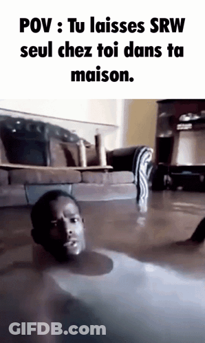 A Man Is Laying On The Floor In A Flooded Living Room GIF
