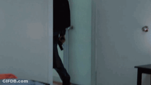 A Man Is Laying On The Floor With Blood On His T-Shirt GIF