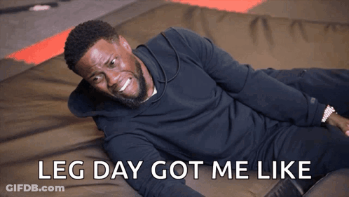 A Man Is Laying On The Floor With The Words Leg Day Got Me Like Behind Him GIF