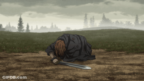 A Man Is Laying On The Ground With A Sword In His Hand GIF
