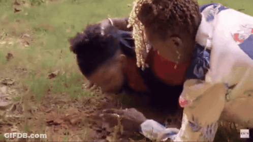 A Man Is Laying On The Ground With A Woman Standing Next To Him With A Bbc Logo In The Corner GIF
