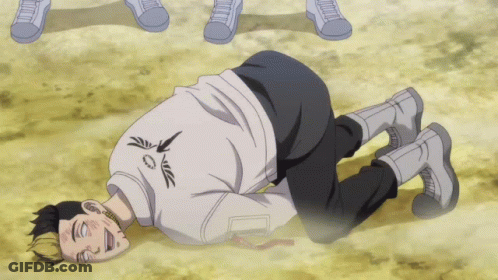 A Man Is Laying On The Ground With His Eyes Closed And A White Shirt With The Letter A On It GIF