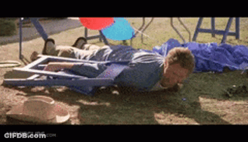 A Man Is Laying On The Ground With Movieclips.com Written On The Bottom Right GIF