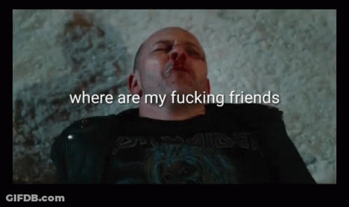 A Man Is Laying On The Ground With The Words Where Are My Fucking Friends Above Him GIF