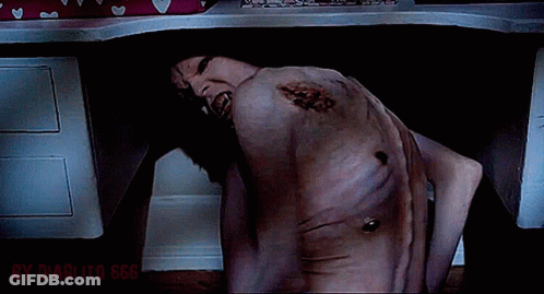 A Man Is Laying Under A Desk With The Words By Diablito 666 Written On The Bottom GIF