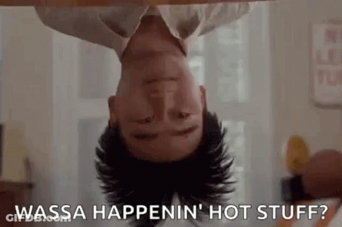 A Man Is Laying Upside Down On A Table With His Head Down And Says `` Wasa Happenin ' Hot Stuff '' . GIF