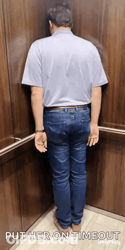 A Man Is Leaning Against A Wall In An Elevator And The Caption Says Put Her On Timeout GIF