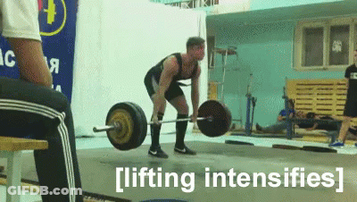 A Man Is Lifting A Barbell In A Gym With The Words Lifting Intensifies Behind Him GIF