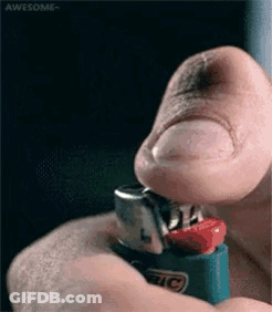 A Man Is Lighting A Bic Lighter With His Finger GIF