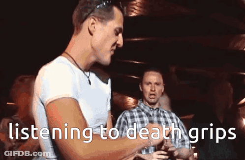 A Man Is Listening To Death Grips While Holding A Glass GIF