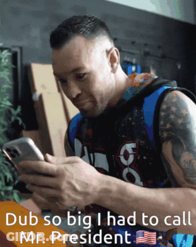A Man Is Looking At A Cell Phone With The Words Dub So Big I Had To Call Mr. President GIF