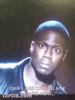 A Man Is Looking At The Camera And Says `` Okr 'S Are Coming Any Minute Now . '' GIF