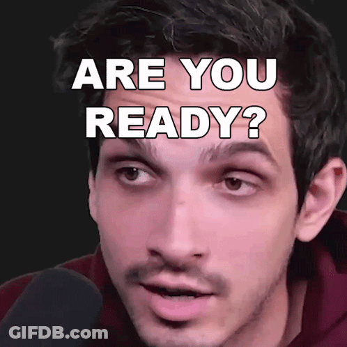 A Man Is Looking At The Camera With The Words " Are You Ready " On His Face GIF