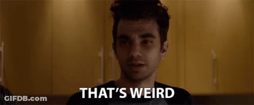 Man Looking At Camera With That's Weird Text GIF