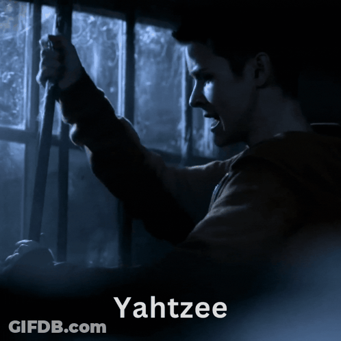 A Man Is Looking Out A Window And The Word Yahtzee Is On The Bottom GIF