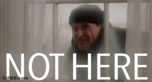 A Man Is Looking Out Of A Window With The Words Not Here Behind Him GIF