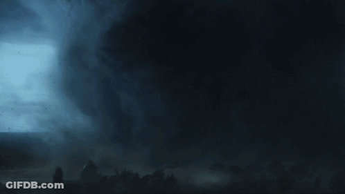 A Man Is Looking Through A Camera Lens That Says ' Canon ' On It GIF
